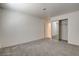 Spacious bedroom with mirrored closet doors and plush carpet at 439 Columbia Ct, Boulder City, NV 89005