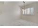 Bright dining room featuring tile flooring, a modern light fixture, and large window at 439 Columbia Ct, Boulder City, NV 89005