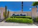 Community entrance with desert landscaping, including cacti and colorful flowers, providing a welcoming touch at 439 Columbia Ct, Boulder City, NV 89005