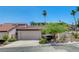 Charming single-story home featuring a red tile roof, well-manicured landscaping, and a two-car garage at 439 Columbia Ct, Boulder City, NV 89005