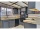 Efficient kitchen featuring modern appliances, dark cabinets, and durable countertops at 439 Columbia Ct, Boulder City, NV 89005