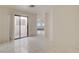 Bright living room with tile floors and sliding glass door to outdoor area at 439 Columbia Ct, Boulder City, NV 89005