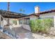 Charming patio area with stone steps, pavers, and a wooden pergola for relaxing or entertaining outdoors at 439 Columbia Ct, Boulder City, NV 89005