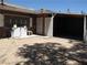 Outdoor area with laundry appliances, brick accents, and convenient access, blending functionality with style at 4950 Burnham Ave, Las Vegas, NV 89119