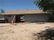 View of the exterior of the building with a large door, providing open space and accessibility at 4950 Burnham Ave, Las Vegas, NV 89119