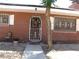 Charming brick home featuring a secure wrought iron door and window accents at 4950 Burnham Ave, Las Vegas, NV 89119