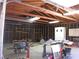 Spacious garage with high ceilings and unfinished walls featuring work tables at 4950 Burnham Ave, Las Vegas, NV 89119