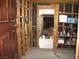 View from unfinished storage area leading into garage with door to the left at 4950 Burnham Ave, Las Vegas, NV 89119