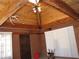 Spacious living room featuring a vaulted ceiling and exposed beams at 4950 Burnham Ave, Las Vegas, NV 89119