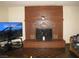 Cozy living room features a brick fireplace and classic parquet floors at 4950 Burnham Ave, Las Vegas, NV 89119