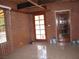 Large living room featuring tiled floors and multiple glass doors at 4950 Burnham Ave, Las Vegas, NV 89119