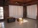 Spacious living room featuring a vaulted ceiling and exposed beams at 4950 Burnham Ave, Las Vegas, NV 89119