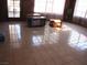 Tile floors and lots of bright sunlight fill the large living room at 4950 Burnham Ave, Las Vegas, NV 89119