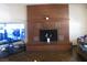 Living room featuring a large brick fireplace, perfect for gatherings and cozy evenings at 4950 Burnham Ave, Las Vegas, NV 89119