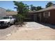 Cozy patio area with stone pavers and adjacent parking, perfect for outdoor enjoyment at 4950 Burnham Ave, Las Vegas, NV 89119