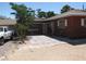 Cozy patio area with stone pavers and adjacent parking, perfect for outdoor enjoyment at 4950 Burnham Ave, Las Vegas, NV 89119