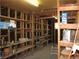 Image of the unfinished storage area featuring wooden support beams and wooden shelving at 4950 Burnham Ave, Las Vegas, NV 89119