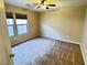 This bedroom has neutral walls, carpeted flooring, and a window with blinds at 5361 Candlespice Way, Las Vegas, NV 89135