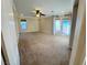 Large carpeted bonus room with natural light streaming through the windows at 5361 Candlespice Way, Las Vegas, NV 89135