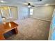 Spacious bonus room with carpet, ceiling fan, and lots of natural light at 5361 Candlespice Way, Las Vegas, NV 89135