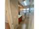 Convenient laundry room with washer, dryer, utility sink, and upper storage cabinets at 5361 Candlespice Way, Las Vegas, NV 89135