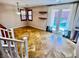 Open living room with tile flooring, French doors to the backyard, and two floating shelves at 5361 Candlespice Way, Las Vegas, NV 89135