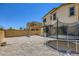 Backyard featuring a trampoline, gravel, and block wall at 5606 Verde Valley Ct, North Las Vegas, NV 89081