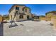 Gravel backyard featuring a basketball hoop and trampoline provides outdoor play space at 5606 Verde Valley Ct, North Las Vegas, NV 89081