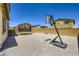 Backyard with a basketball hoop and trampoline offers space for Gathering fun at 5606 Verde Valley Ct, North Las Vegas, NV 89081