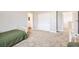 Bedroom featuring a twin bed, carpet and access to the hall and bathroom at 5606 Verde Valley Ct, North Las Vegas, NV 89081