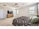 Spacious bedroom with carpet and a ceiling fan for comfort at 5606 Verde Valley Ct, North Las Vegas, NV 89081