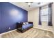 Cozy bedroom featuring a large window and blue accent wall, creating a relaxing atmosphere at 5606 Verde Valley Ct, North Las Vegas, NV 89081