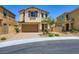 Charming two-story home with a two-car garage and a well-maintained front yard at 5606 Verde Valley Ct, North Las Vegas, NV 89081