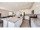 Modern kitchen with a large granite island and stainless steel appliances, perfect for entertaining at 5606 Verde Valley Ct, North Las Vegas, NV 89081