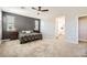 Spacious bedroom with ceiling fan, carpeted floor and ample natural light at 5606 Verde Valley Ct, North Las Vegas, NV 89081
