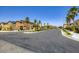 Street with palm trees, desert landscaping, and sidewalks at 5606 Verde Valley Ct, North Las Vegas, NV 89081