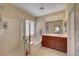 Bright bathroom with walk in shower, large soaking tub, double sink vanity, and large framed mirror at 5916 Sorto Lago St, North Las Vegas, NV 89081