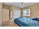 Cozy bedroom with soft carpet, a queen-sized bed, and a closet with lots of storage at 5916 Sorto Lago St, North Las Vegas, NV 89081
