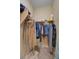 Walk-in closet with ample hanging space and some clothing items at 5916 Sorto Lago St, North Las Vegas, NV 89081