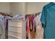Walk-in closet with ample storage space with multiple clothing items at 5916 Sorto Lago St, North Las Vegas, NV 89081
