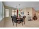 Charming dining area with contemporary light fixture and view to the backyard at 5916 Sorto Lago St, North Las Vegas, NV 89081