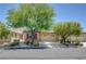 Charming single-story home featuring a desert landscape, two-car garage and ample trees in front at 5916 Sorto Lago St, North Las Vegas, NV 89081