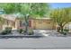 Inviting single-story home with a manicured front yard, desert landscaping, and an attached two-car garage at 5916 Sorto Lago St, North Las Vegas, NV 89081