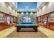 Inviting game room featuring pool tables, stylish lighting, and comfortable seating at 5916 Sorto Lago St, North Las Vegas, NV 89081