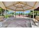 Shaded gazebo offers a place to rest and relax with views of the tennis courts at 5916 Sorto Lago St, North Las Vegas, NV 89081