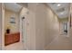 Hallway features neutral paint, tile floor, and recessed lighting, creating a clean and inviting transitional space at 5916 Sorto Lago St, North Las Vegas, NV 89081