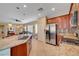Modern kitchen with stainless steel appliances, tile backsplash, and an eat-in island at 5916 Sorto Lago St, North Las Vegas, NV 89081