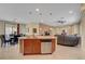 Kitchen featuring a dining area, an eat-in island, and tile flooring at 5916 Sorto Lago St, North Las Vegas, NV 89081