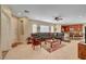 Spacious open-concept living room with tile floors and a seamless flow into a modern kitchen and dining area at 5916 Sorto Lago St, North Las Vegas, NV 89081