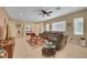 Expansive living room with tile flooring, a large sectional sofa, and views to the bedroom and entryway at 5916 Sorto Lago St, North Las Vegas, NV 89081